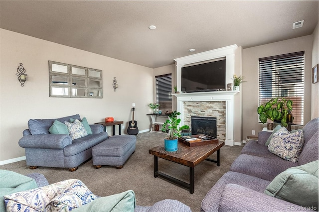 9652 Emerald Vista Dr, Peyton, CO 80831 - living room featuring carpet floors and a stone fireplace