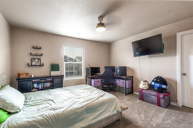 9652 Emerald Vista Dr, Peyton, CO 80831 - bedroom with carpet flooring, a desk, a textured ceiling, and ceiling fan