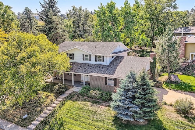 3150 Lane Ct, Boulder, CO 80305 - traditional home featuring a chimney and a patio area