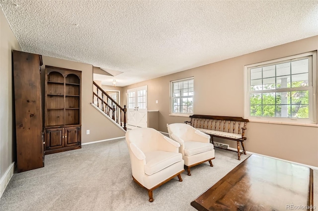 3150 Lane Ct, Boulder, CO 80305 - sitting room featuring stairway, a textured ceiling, carpet, and baseboards