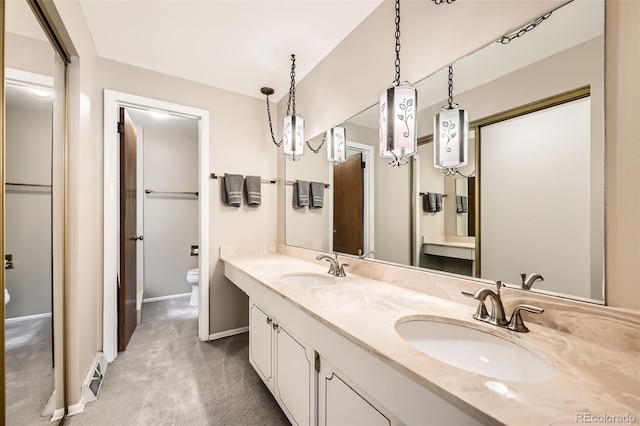 3150 Lane Ct, Boulder, CO 80305 - full bath featuring toilet, baseboards, and double vanity