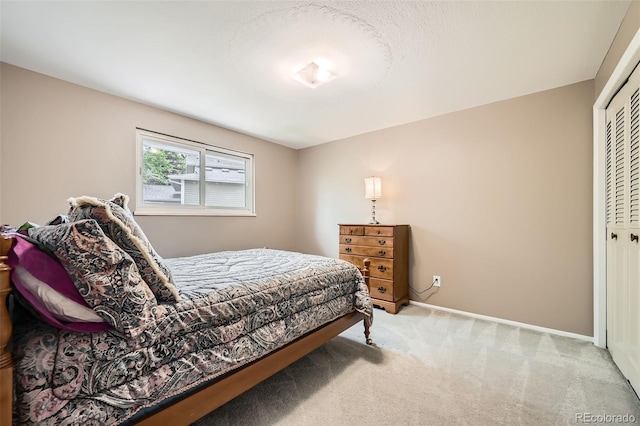 3150 Lane Ct, Boulder, CO 80305 - bedroom with light carpet, a closet, and baseboards