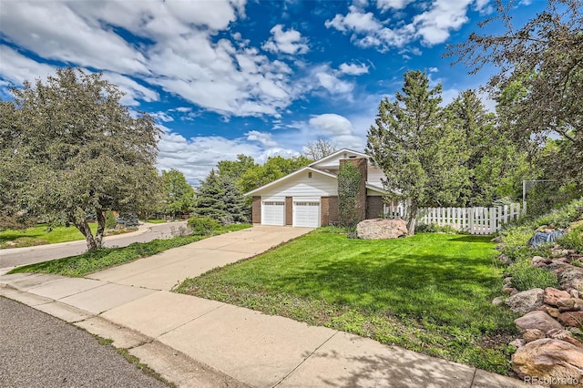 3150 Lane Ct, Boulder, CO 80305 - view of front facade with concrete driveway, brick siding, and a garage