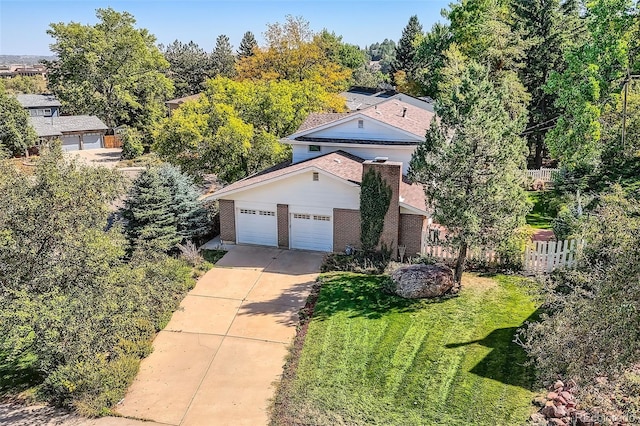 3150 Lane Ct, Boulder, CO 80305 - view of front of house with concrete driveway, brick siding, and an attached garage