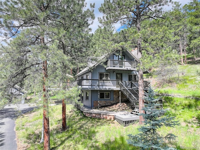 30221 Marge Ln, Evergreen, CO 80439 - rear view of property featuring a wooden deck, stairway, and a chimney