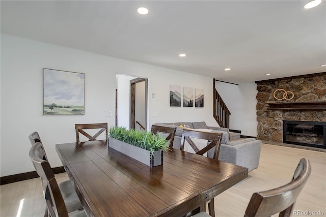 30221 Marge Ln, Evergreen, CO 80439 - dining room with stairs, recessed lighting, and a fireplace