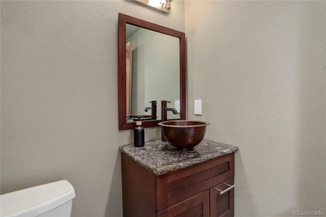 30221 Marge Ln, Evergreen, CO 80439 - half bath with vanity and toilet