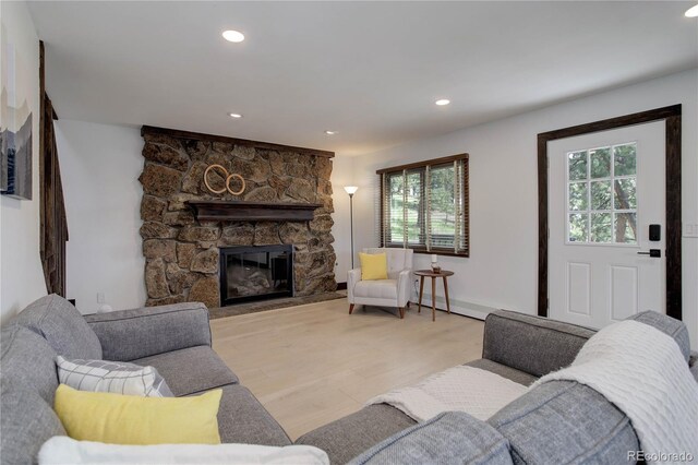 30221 Marge Ln, Evergreen, CO 80439 - living area with a stone fireplace, recessed lighting, and light wood-type flooring