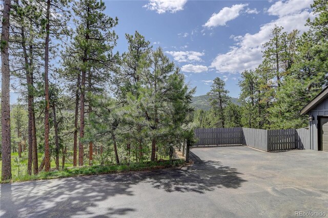 30221 Marge Ln, Evergreen, CO 80439 - view of asphalt driveway with a gate and a mountain view