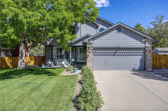 11760 Eudora Ct, Thornton, CO 80233 - view of front of house with driveway, an attached garage, and brick siding