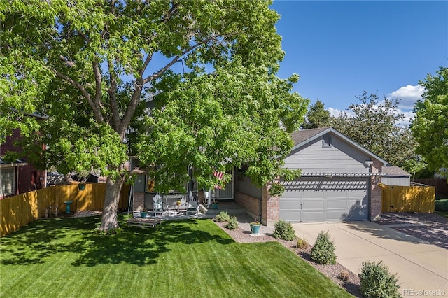 11760 Eudora Ct, Thornton, CO 80233 - view of front of home featuring concrete driveway, an attached garage, and brick siding