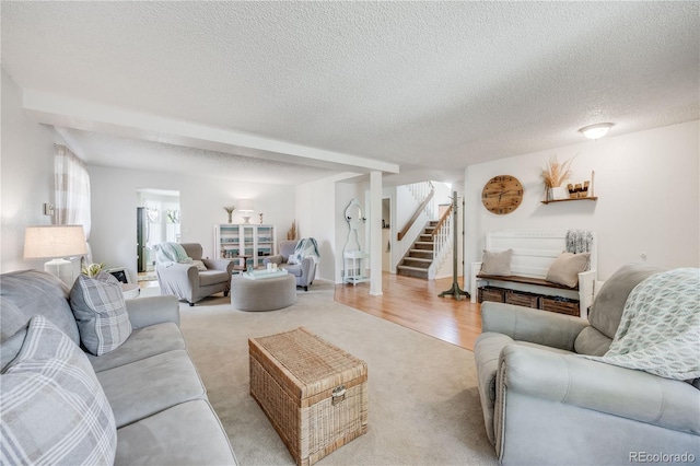 11760 Eudora Ct, Thornton, CO 80233 - living area featuring light carpet, stairs, and a textured ceiling