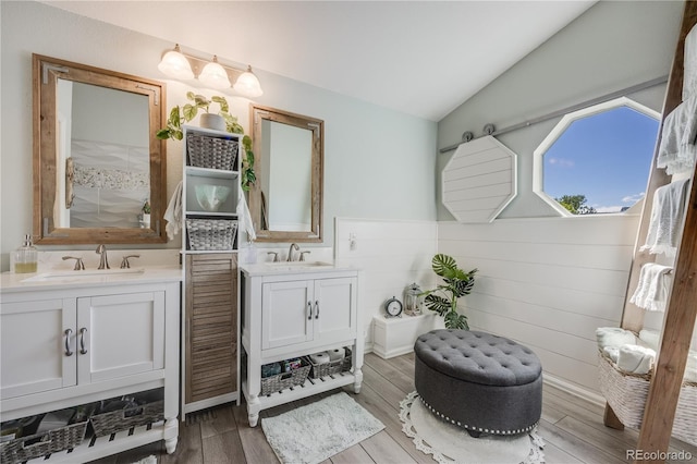 11760 Eudora Ct, Thornton, CO 80233 - full bath featuring two vanities, lofted ceiling, and wood finished floors
