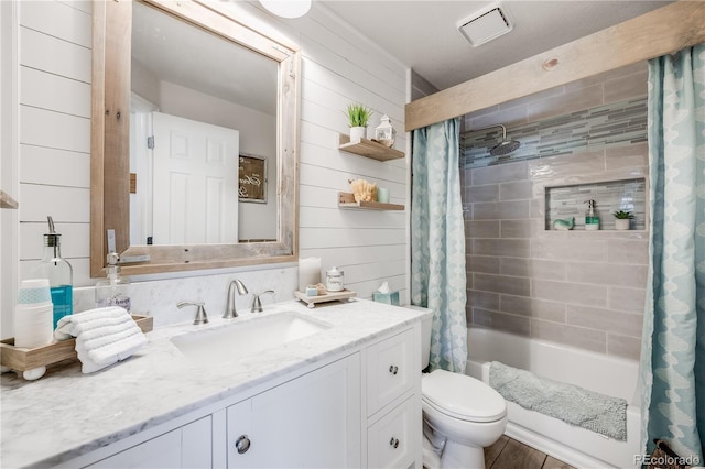 11760 Eudora Ct, Thornton, CO 80233 - full bathroom featuring shower / bathtub combination with curtain, toilet, vanity, and wood walls