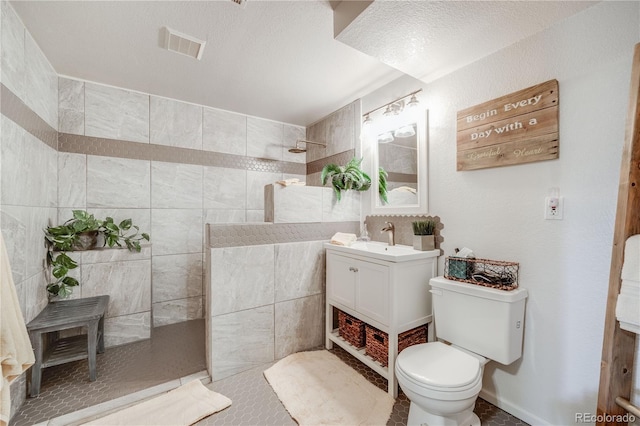 11760 Eudora Ct, Thornton, CO 80233 - full bathroom with walk in shower, toilet, vanity, and tile patterned floors