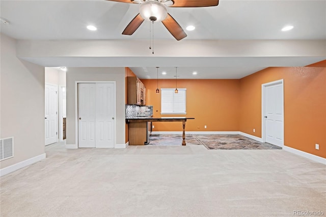 interior space with visible vents, baseboards, light colored carpet, recessed lighting, and a ceiling fan