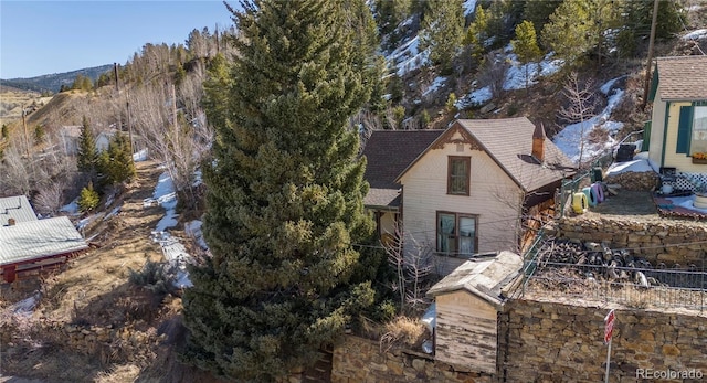 300 Spring St, Central City, CO 80427 - view of property exterior featuring a shingled roof and a mountain view