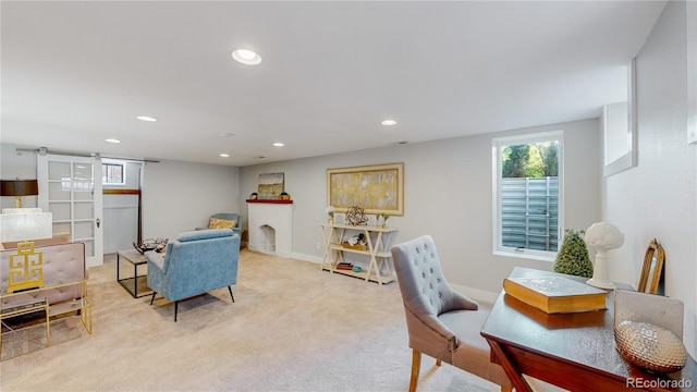 carpeted office with a fireplace