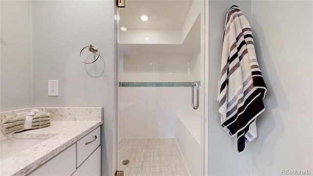 bathroom with vanity and an enclosed shower