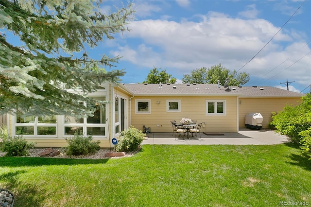 4803 N Weber St, Colorado Springs, CO 80907 - rear view of property featuring a patio and a lawn