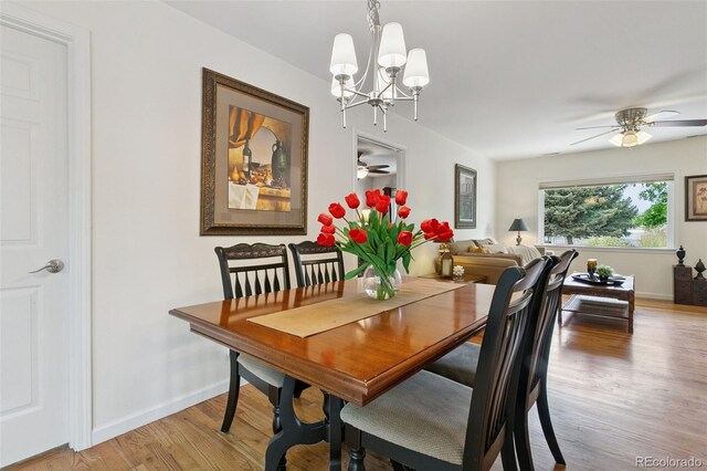 4803 N Weber St, Colorado Springs, CO 80907 - dining space with ceiling fan, a chandelier, and light wood-style flooring