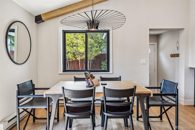 249 E Coyote Ct, Silverthorne, CO 80498 - dining area featuring light wood-style floors, beamed ceiling, and a baseboard radiator