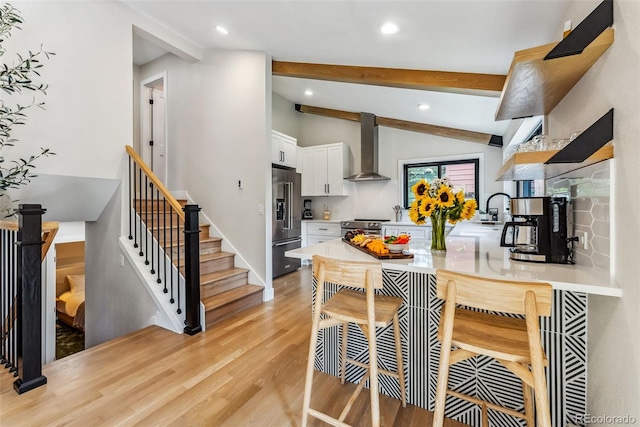 249 E Coyote Ct, Silverthorne, CO 80498 - kitchen featuring wall chimney exhaust hood, high quality fridge, stainless steel electric range, recessed lighting, and light wood finished floors