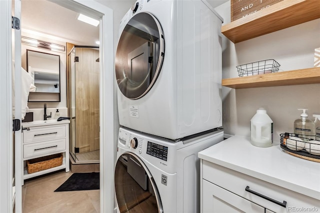 249 E Coyote Ct, Silverthorne, CO 80498 - washroom with stacked washing machine and dryer and light tile patterned flooring