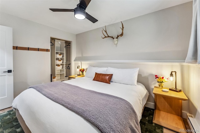 249 E Coyote Ct, Silverthorne, CO 80498 - bedroom featuring a baseboard heating unit and ceiling fan