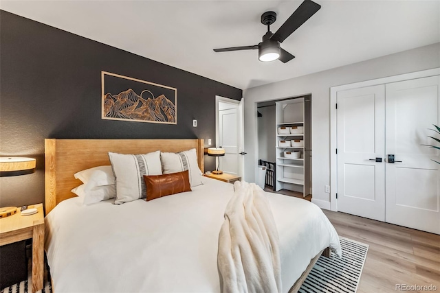 249 E Coyote Ct, Silverthorne, CO 80498 - bedroom featuring multiple closets, wood finished floors, and a ceiling fan