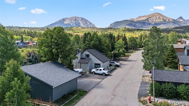 249 E Coyote Ct, Silverthorne, CO 80498 - view of mountain background featuring a heavily wooded area