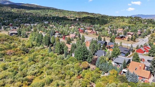 249 E Coyote Ct, Silverthorne, CO 80498 - aerial view of property and surrounding area featuring mountains and nearby suburban area