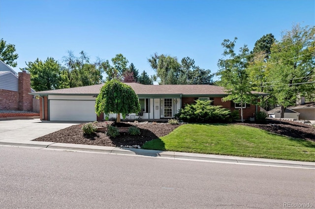 ranch-style house with a garage and a front yard