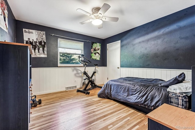 bedroom featuring hardwood / wood-style floors and ceiling fan