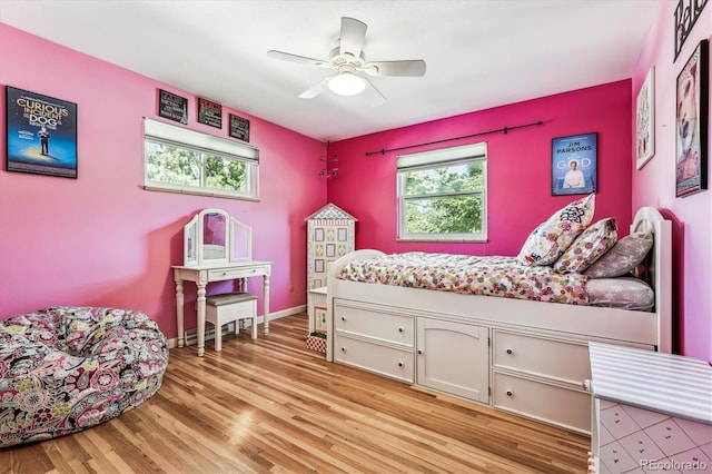 bedroom featuring light wood-type flooring and ceiling fan