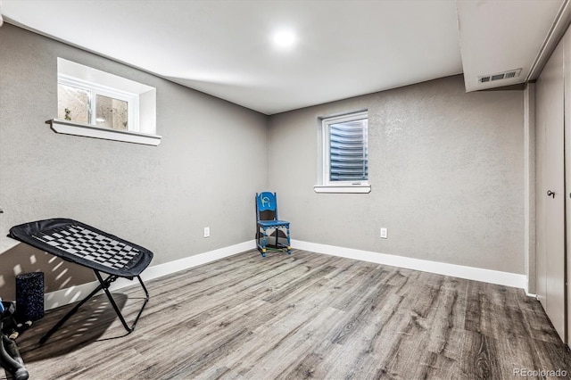 unfurnished room with light wood-type flooring