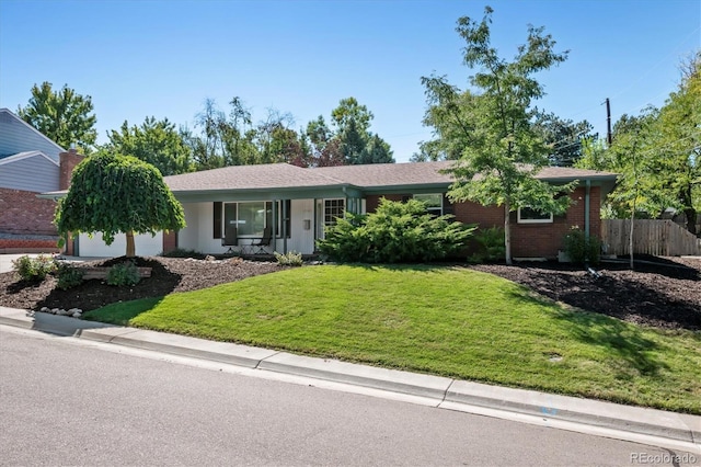 ranch-style home with a front yard