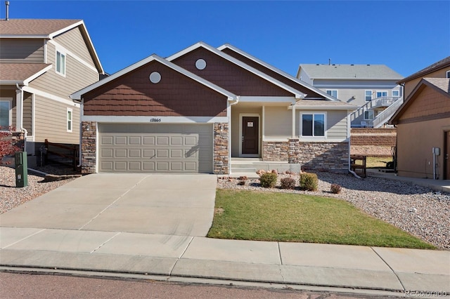 craftsman inspired home with a garage and a front yard