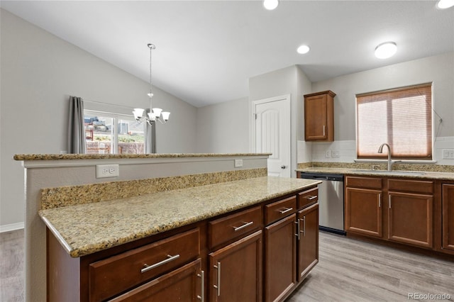 kitchen with lofted ceiling, dishwasher, sink, light stone countertops, and light wood-type flooring