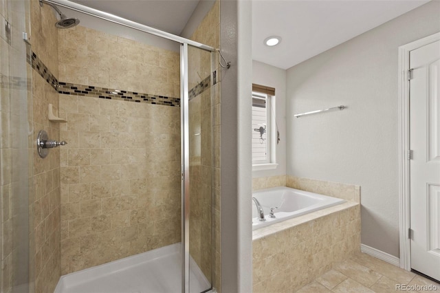 bathroom with independent shower and bath and tile patterned floors