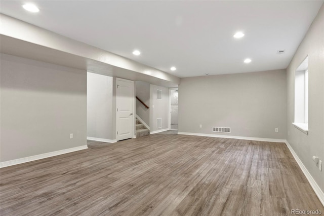 basement featuring hardwood / wood-style flooring