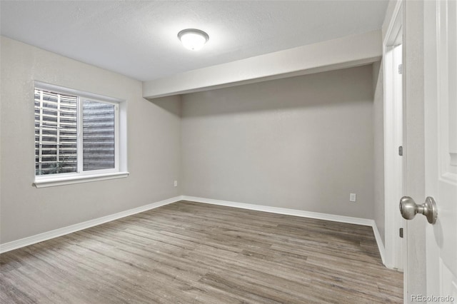 interior space featuring hardwood / wood-style floors and a textured ceiling