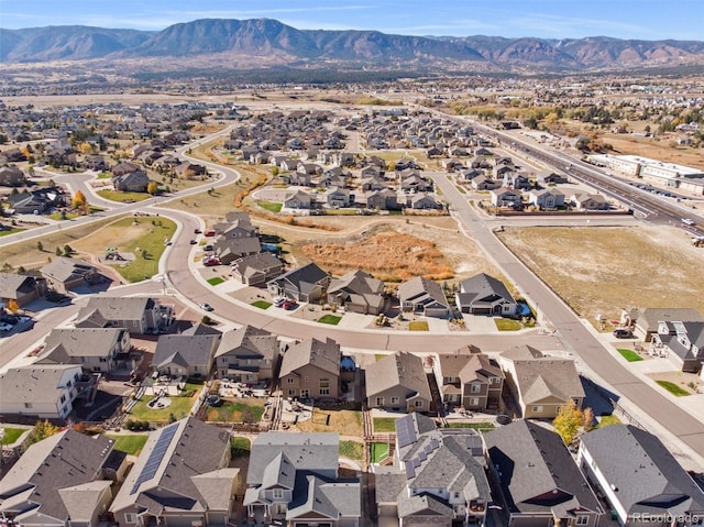 birds eye view of property with a mountain view