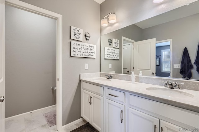 bathroom featuring dual vanity and tile patterned flooring