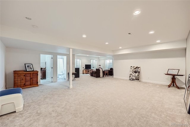 living area featuring light colored carpet