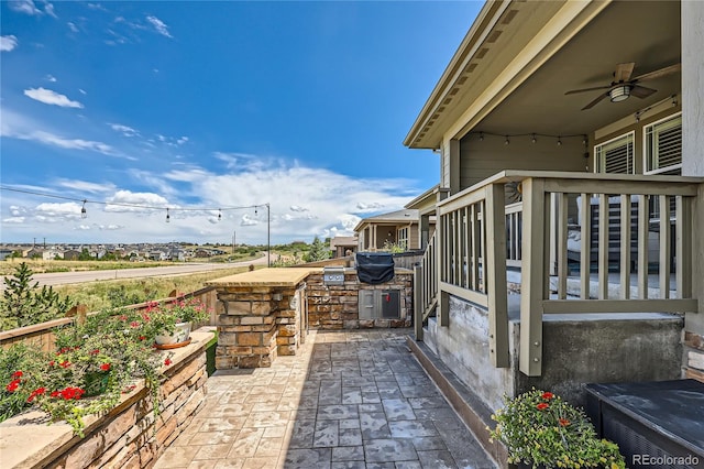 view of patio with ceiling fan and exterior kitchen