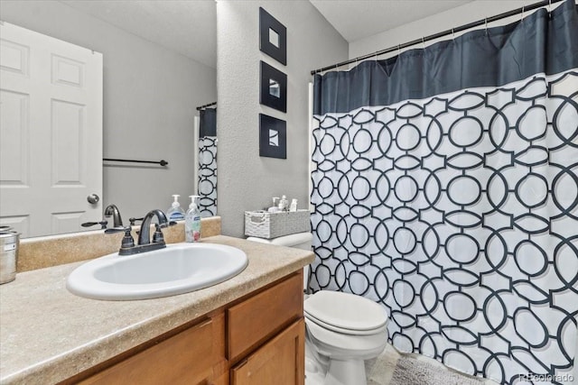 5404 Fawn Ridge Way, Castle Rock, CO 80104 - full bath featuring vanity, a textured wall, toilet, and curtained shower