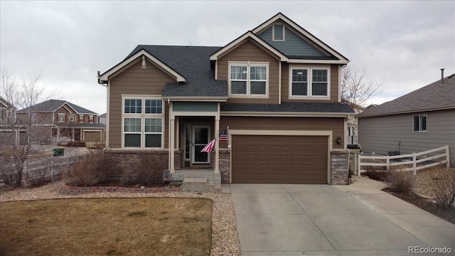 5404 Fawn Ridge Way, Castle Rock, CO 80104 - craftsman-style home featuring brick siding, a garage, concrete driveway, and roof with shingles