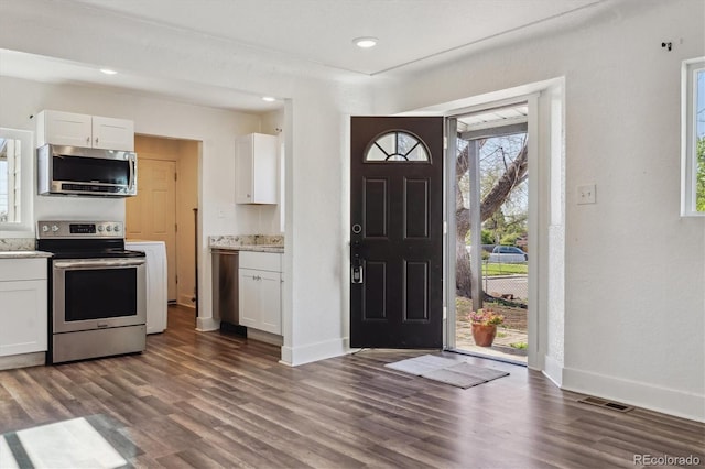 4401 W Mississippi Ave, Denver, CO 80219 - foyer featuring dark wood-style floors, baseboards, and recessed lighting