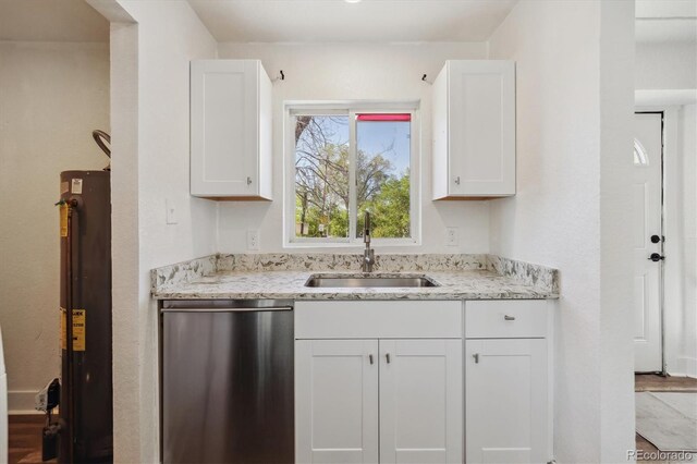 4401 W Mississippi Ave, Denver, CO 80219 - kitchen featuring stainless steel dishwasher, a sink, water heater, and white cabinetry